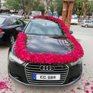 Premium Photo  Black decorated wedding car beautiful bouquet of